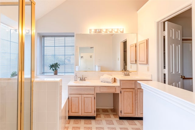 bathroom featuring a shower with door, vanity, and lofted ceiling