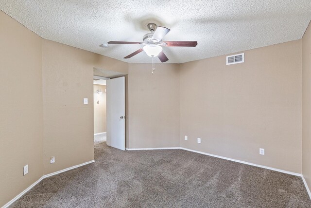 carpeted empty room with a textured ceiling and ceiling fan