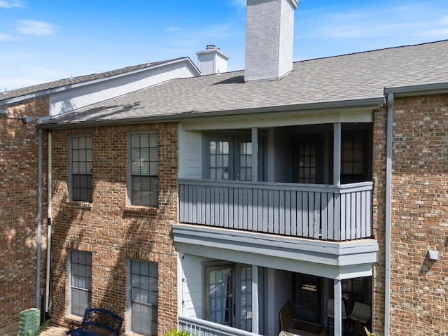 exterior space with a balcony and central air condition unit