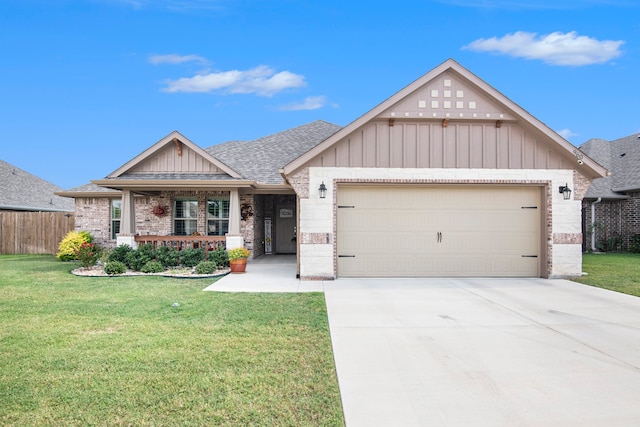 view of front of property with a garage and a front lawn