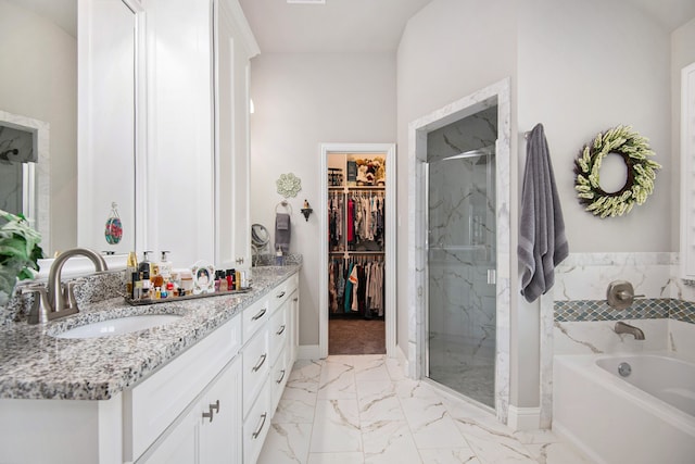 bathroom with plus walk in shower, vanity, and tile patterned flooring