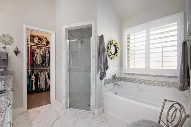 bathroom with shower with separate bathtub, tile patterned flooring, and vaulted ceiling