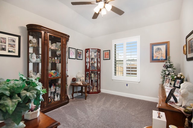 interior space featuring carpet and ceiling fan