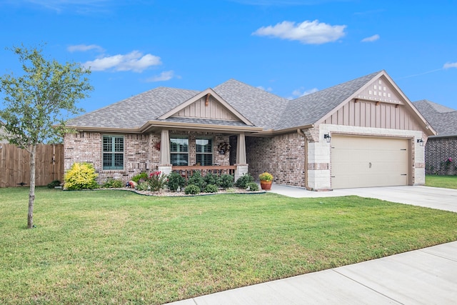 view of front of property featuring a garage and a front yard