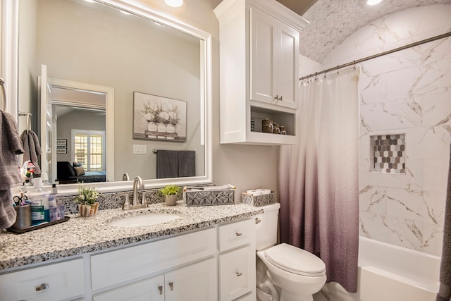 full bathroom with vanity, toilet, and shower / tub combo