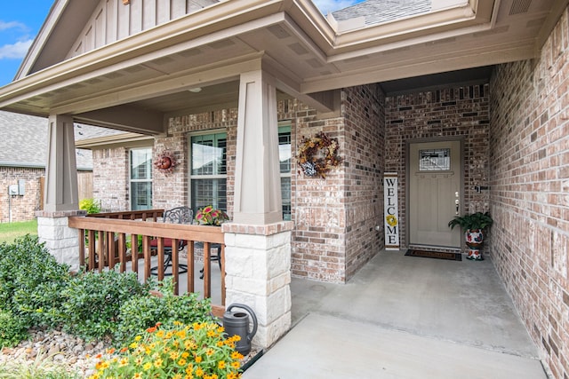 doorway to property with a porch