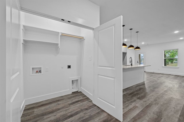 laundry area featuring hookup for a washing machine, hookup for an electric dryer, dark hardwood / wood-style floors, and sink