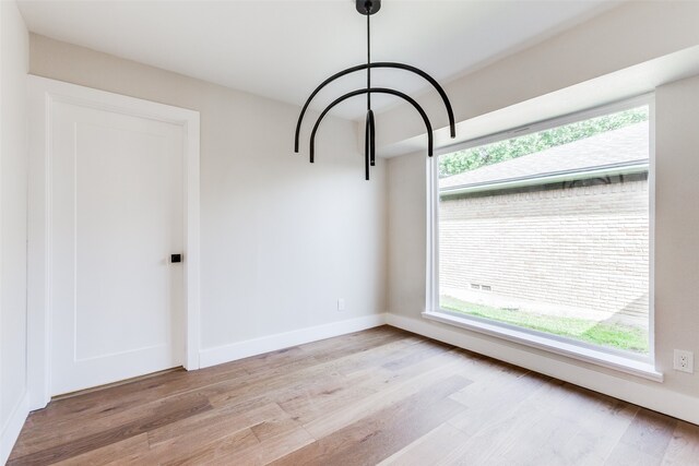 unfurnished dining area with light hardwood / wood-style floors