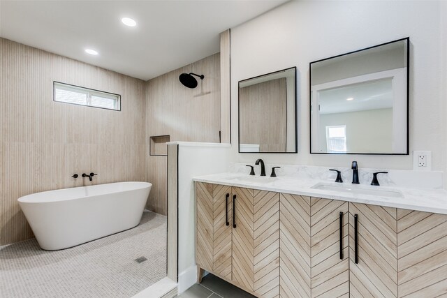 bathroom with tile patterned floors, vanity, and separate shower and tub