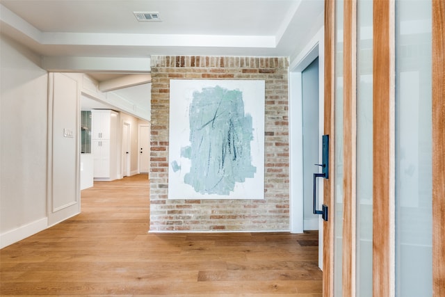 hall with light hardwood / wood-style floors