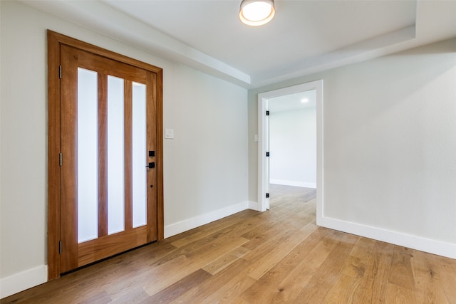 foyer with plenty of natural light and light hardwood / wood-style flooring