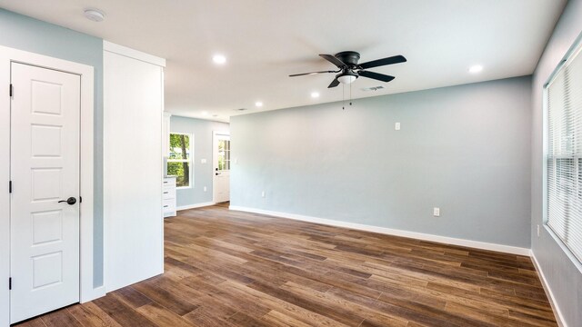 spare room featuring hardwood / wood-style flooring and ceiling fan