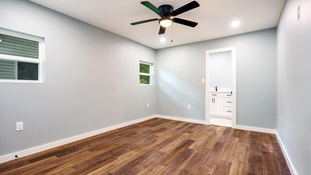 unfurnished room with hardwood / wood-style flooring and ceiling fan