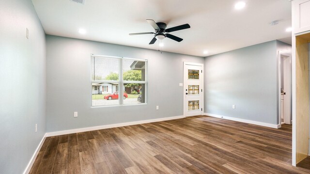 empty room featuring wood-type flooring and ceiling fan