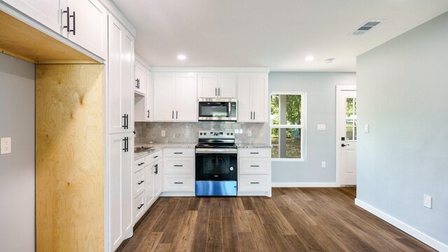 kitchen featuring dark hardwood / wood-style flooring, white cabinetry, and stainless steel appliances