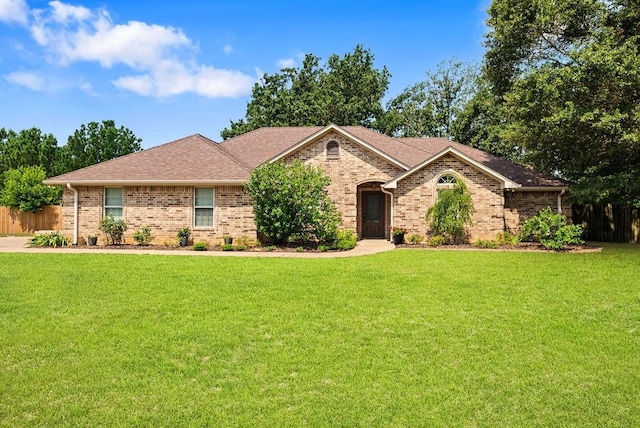 ranch-style home with a front lawn