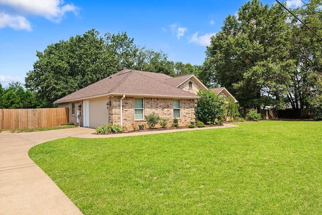 ranch-style home with a front lawn