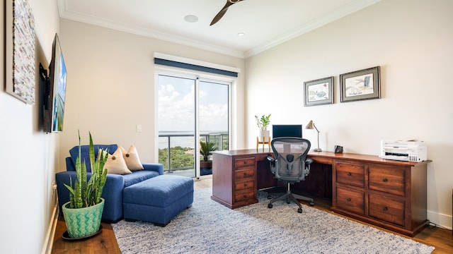 office featuring ceiling fan, wood-type flooring, and ornamental molding