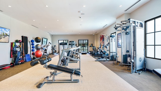 exercise room with light carpet