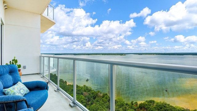 balcony featuring a water view