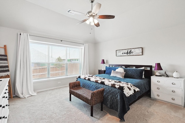 bedroom featuring ceiling fan, vaulted ceiling, and light colored carpet