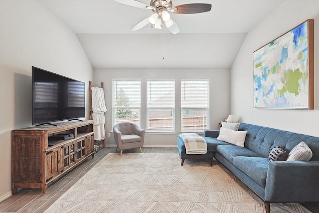 living room featuring hardwood / wood-style flooring, vaulted ceiling, and ceiling fan