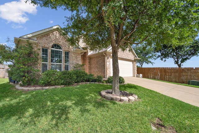 view of front facade featuring a garage and a front lawn