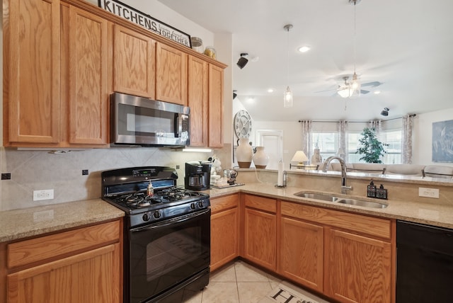 kitchen with ceiling fan, light stone counters, light tile patterned floors, sink, and black appliances