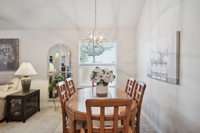 dining space with light carpet and a chandelier