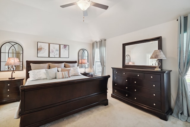 bedroom featuring light colored carpet and ceiling fan