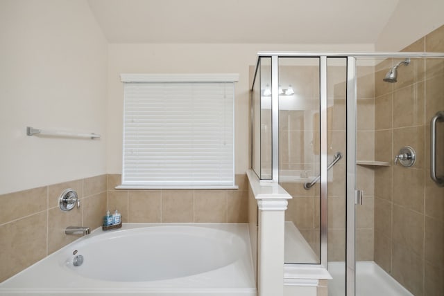 bathroom with shower with separate bathtub