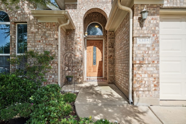 property entrance with a garage