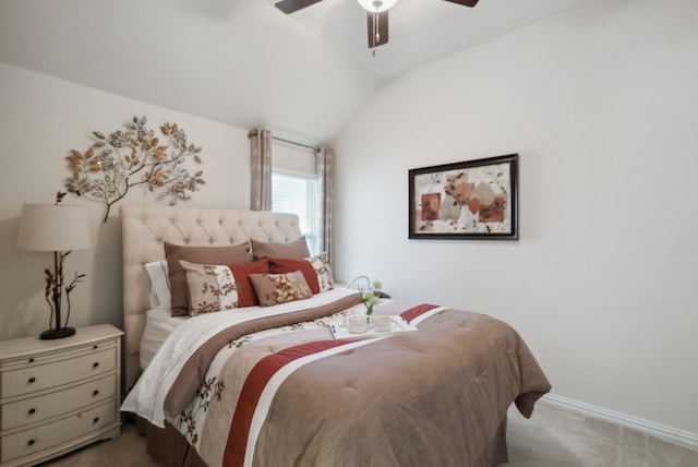 bedroom with ceiling fan, lofted ceiling, and light carpet