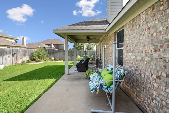 view of patio featuring ceiling fan