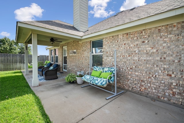 view of patio with ceiling fan and an outdoor living space