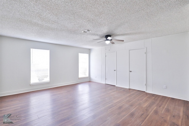 interior space with a textured ceiling, ceiling fan, and hardwood / wood-style floors