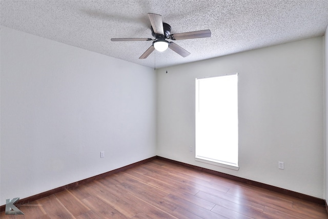 unfurnished room featuring ceiling fan, a textured ceiling, and hardwood / wood-style flooring