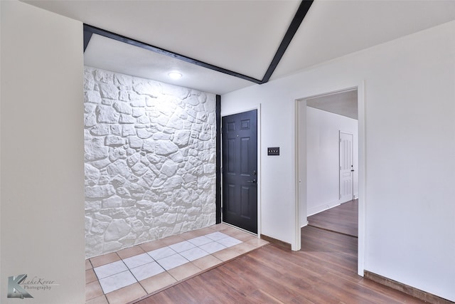 foyer entrance with hardwood / wood-style flooring