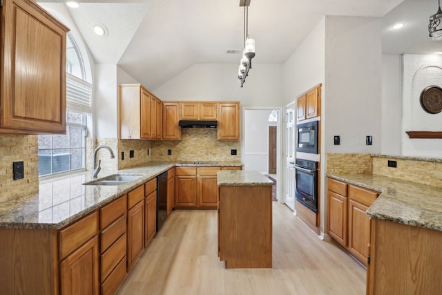 kitchen with backsplash, light stone counters, light hardwood / wood-style floors, black appliances, and sink