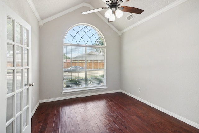 spare room with hardwood / wood-style flooring, a healthy amount of sunlight, crown molding, and vaulted ceiling