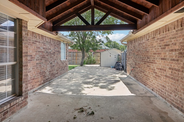 view of patio / terrace featuring a shed