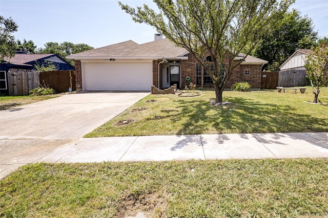 ranch-style home with a garage and a front yard