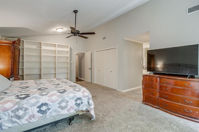 carpeted bedroom featuring lofted ceiling and ceiling fan