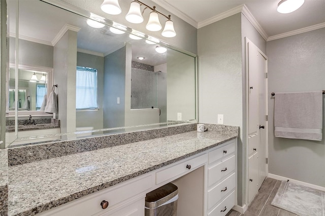 bathroom featuring crown molding, an enclosed shower, and vanity