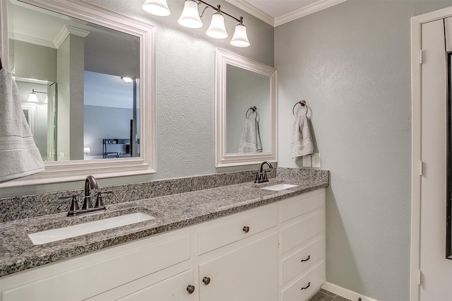 bathroom with ornamental molding and vanity