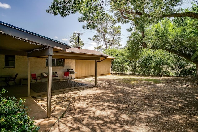 view of patio with a grill