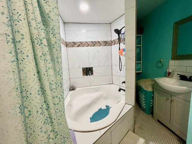 bathroom featuring shower / bath combo with shower curtain, tile patterned floors, and vanity