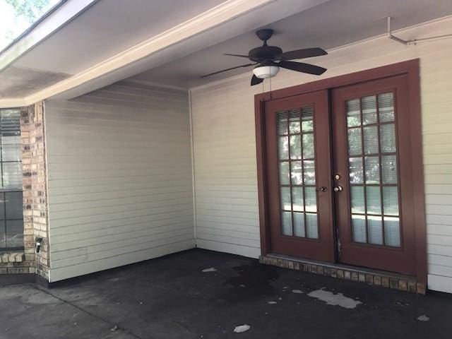 doorway to property with ceiling fan and french doors