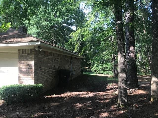 view of side of property with a garage