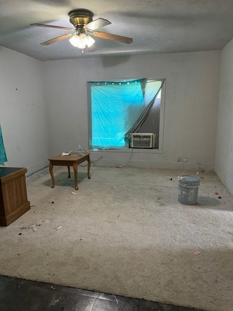 empty room with cooling unit and ceiling fan